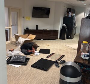 Aiden Minkov assembling the server rack.